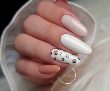 Russian manicure with white almond nails and leopard print accent by Radina Ignatova Aesthete Beauty Dundee