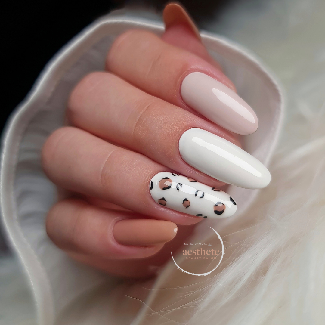 Russian manicure with white almond nails and leopard print accent by Radina Ignatova Aesthete Beauty Dundee