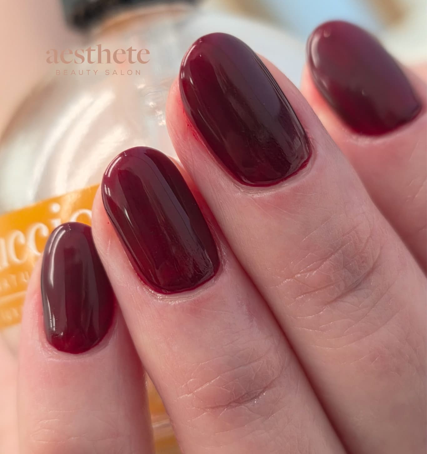 BIAB burgundy red glossy round nails at Aesthete Beauty Dundee