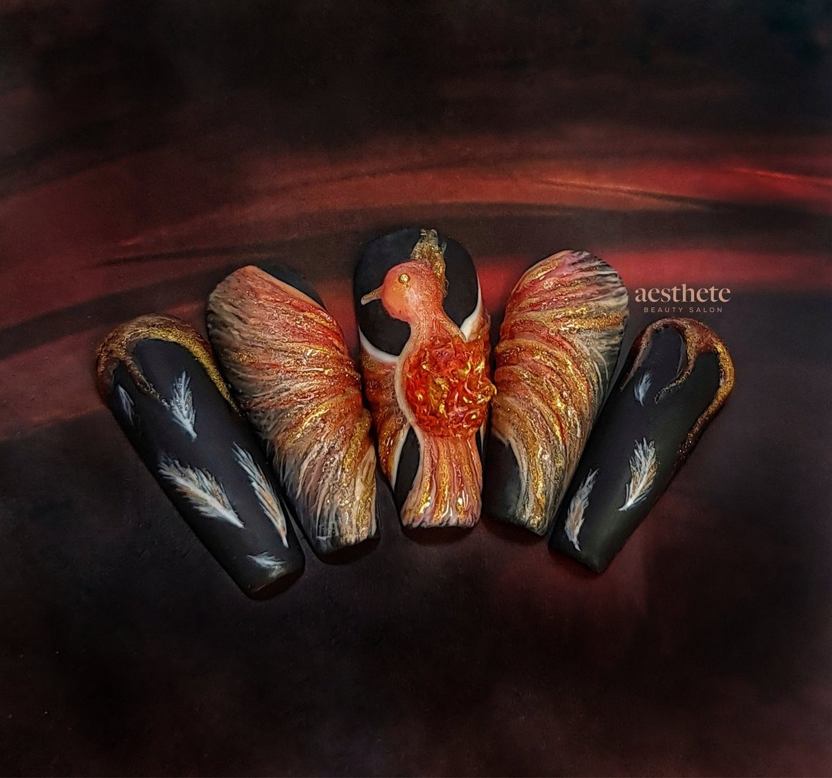 Editorial competition nail art featuring hand-painted phoenix with 3D elements by Radina at Aesthete Beauty Dundee