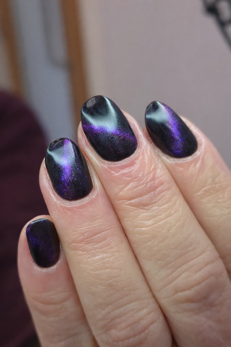Purple cat-eye magnetic nail effect on BIAB strengthened nails at Aesthete Beauty Dundee